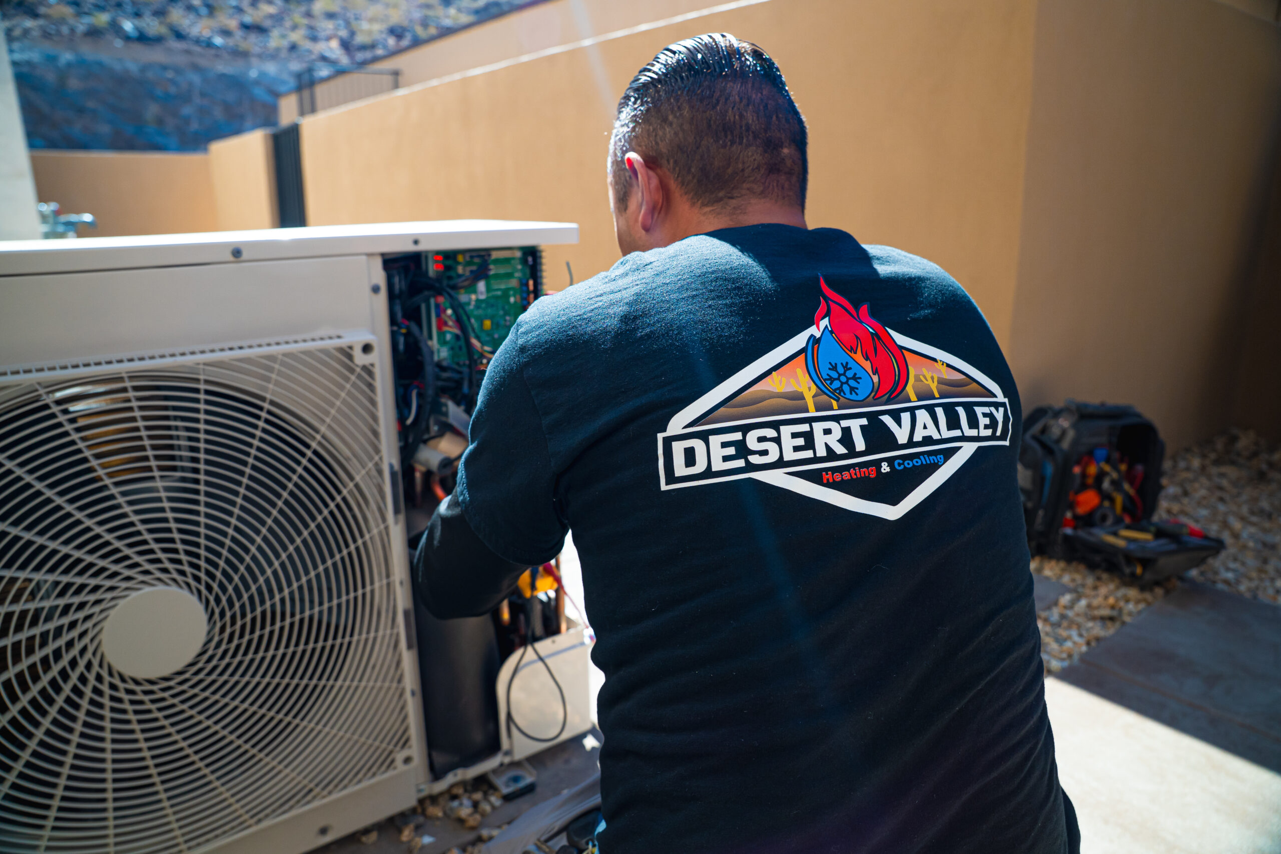 Experienced technician installing AC replacement unit in Las Vegas, NV