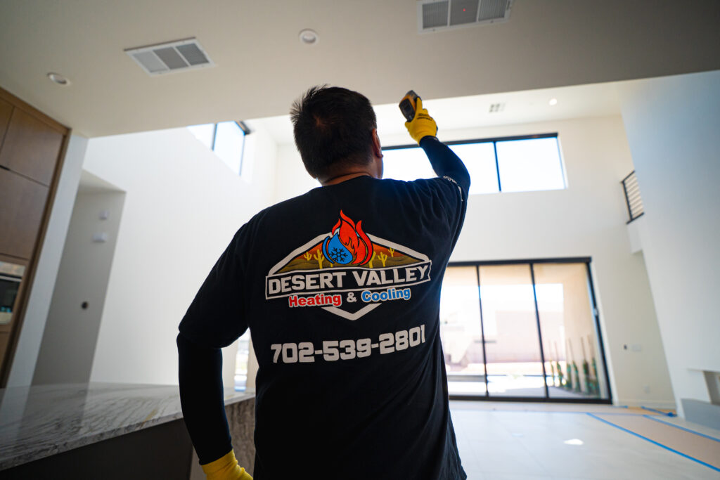 HVAC repair technician serving AC unit in Las Vegas, NV